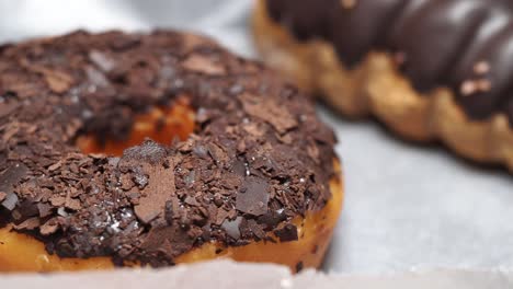 close-up of chocolate donuts with chocolate shavings