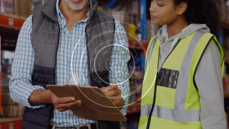 animation of scope scanning over man and woman writing on clipboard in warehouse