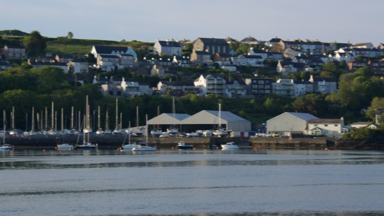 Wide panning shot of Y Felinheli, Port Dinorwic at low tide on the Menal Strait at Moel Y Don, Llanfairpwllgwyngyll