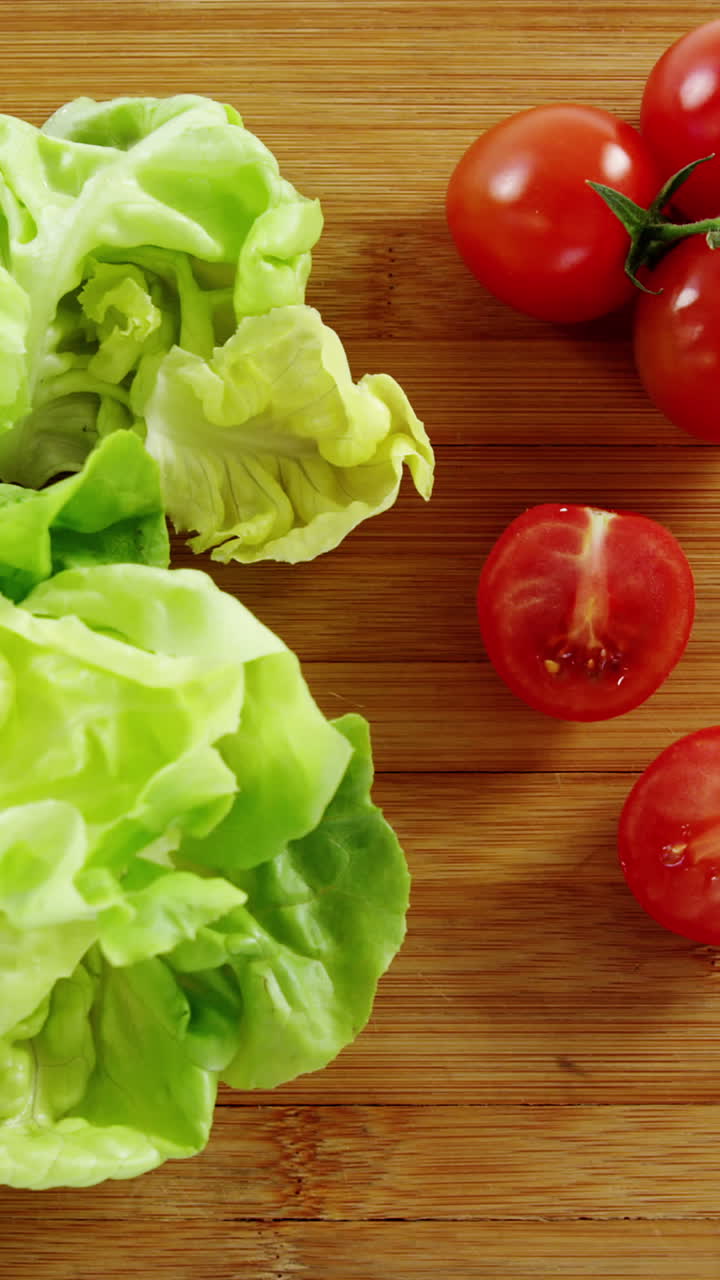 Vegetables and kitchen knife on chopping board