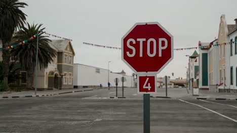 stop sign in a colorful town street