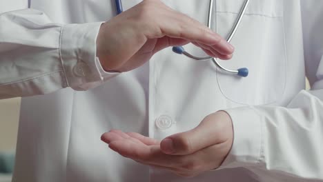 medical doctor with two hands in position to protect something , video in 4k