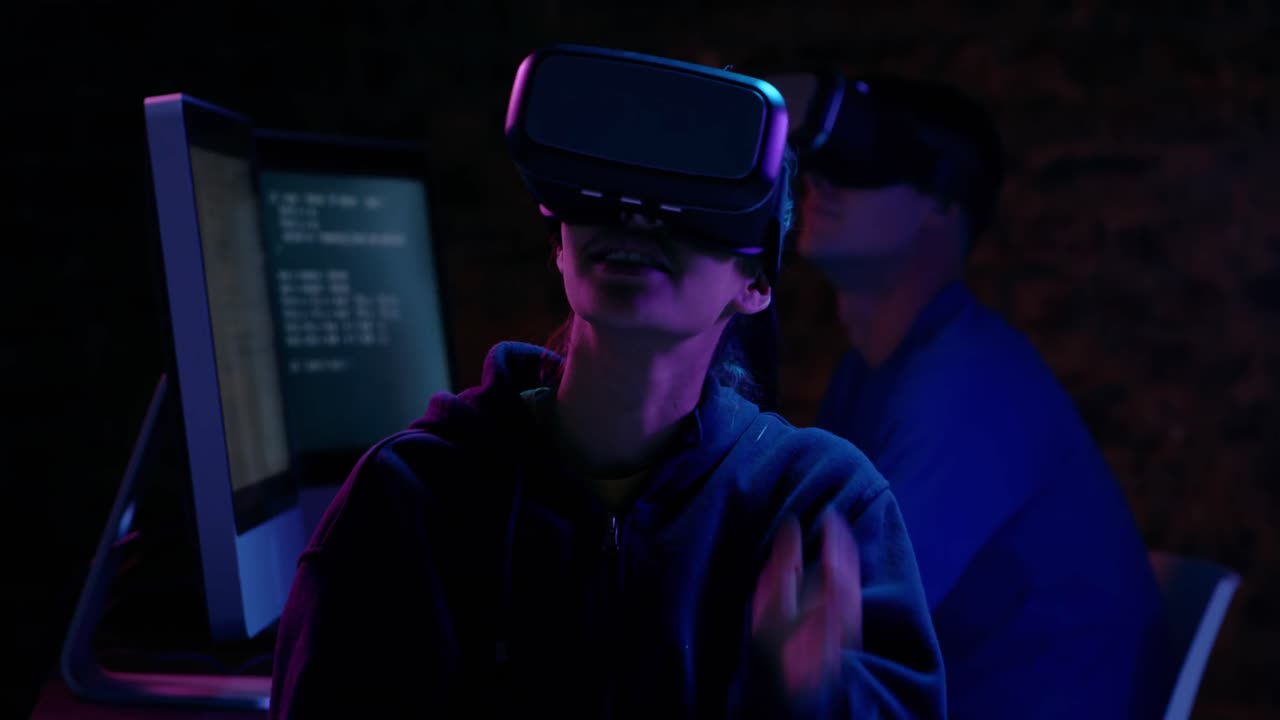 Woman and man using VR headset