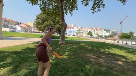 Women playing squash in the park