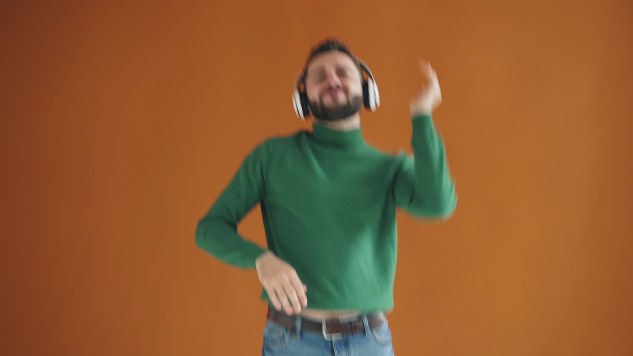 Man Dancing to Music with Headphones