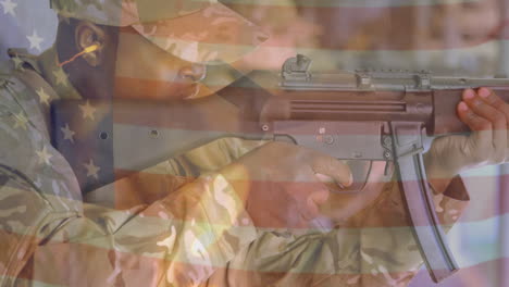 animation of flag of usa over biracial male soldier shooting with rifle