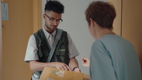 courier delivering express mail to woman at home