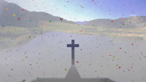colorful confetti falling from sky, shadow of cross cast on landscape