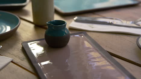 handmade earthenware on restaurant table, camera slider shot