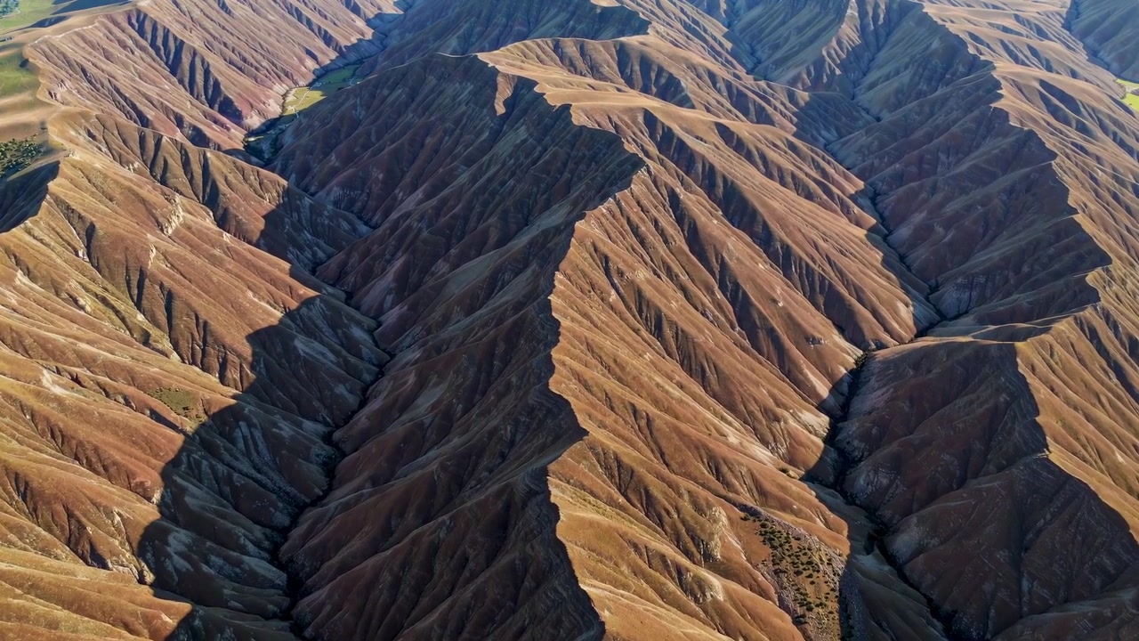 Aerial View of Rugged Mountain Ridges and Deep Canyons