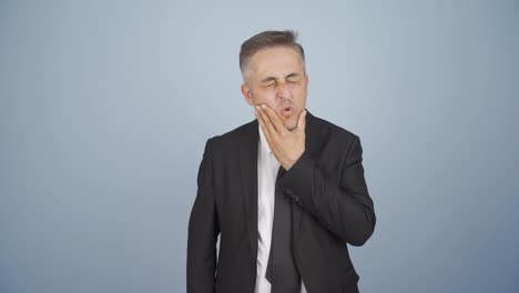 businessman suffering from toothache.