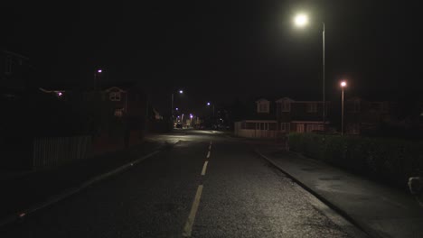 a typical town street in the uk at night