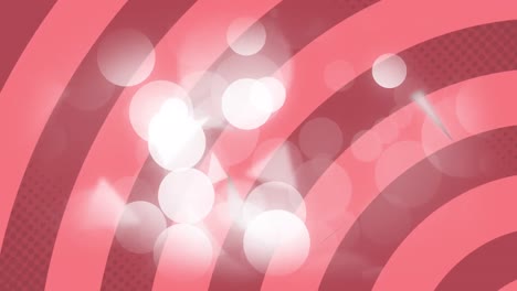 animation of spots of light over red stripes patterned background