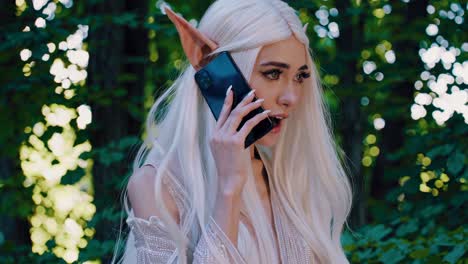 elf girl talking on phone in the forest