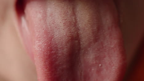 close up of a child sticking out his tongue