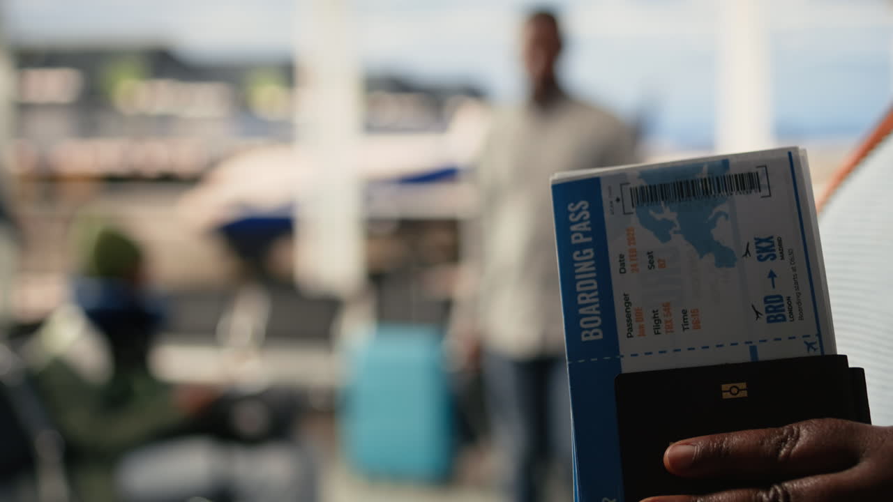 Plane ticket and passport, close up, flight details in airport, departure area