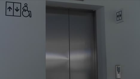 Man Entering Elevator with Accessibility Features