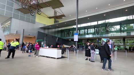 people entering and exiting the museum entrance