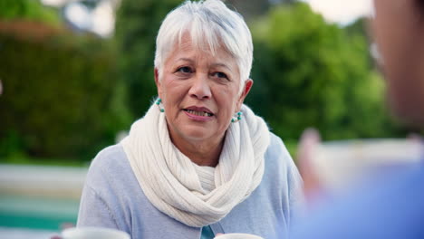 coffee, garden and a senior woman in conversation