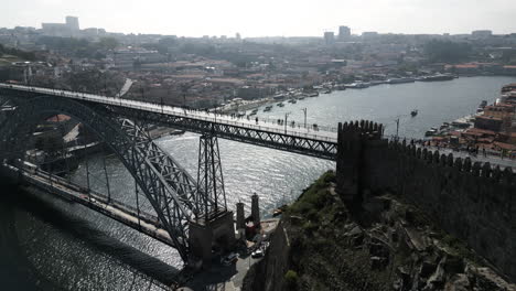 Riverbank-Drone-Shot-of-a-Beautiful-Cityscape-in-Porto,-Portugal