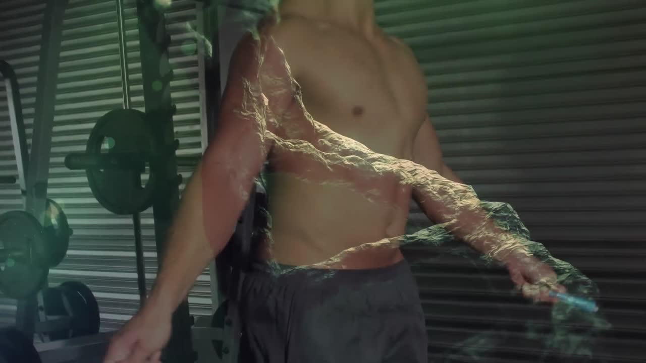 체육관에서 운동하는 근육질의 남자 위에 있는 dna 줄기의 애니메이션