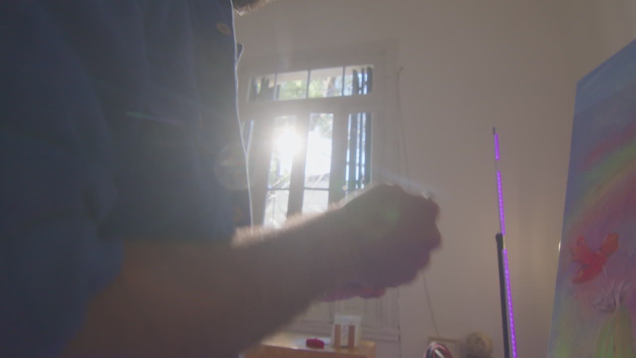 Painter Drawing Buddha on Canvas in Art Studio