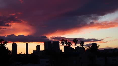 Beautiful,-colorful-timelapse-of-buildings-in-Westwood,-Los-Angeles-during-a-cloudy-sunset