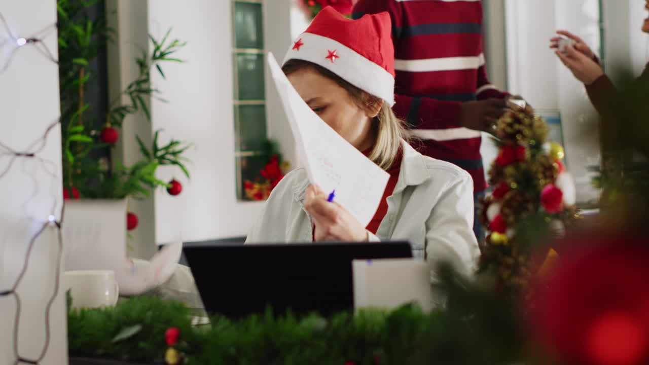 Woman working in festive office during Christmas
