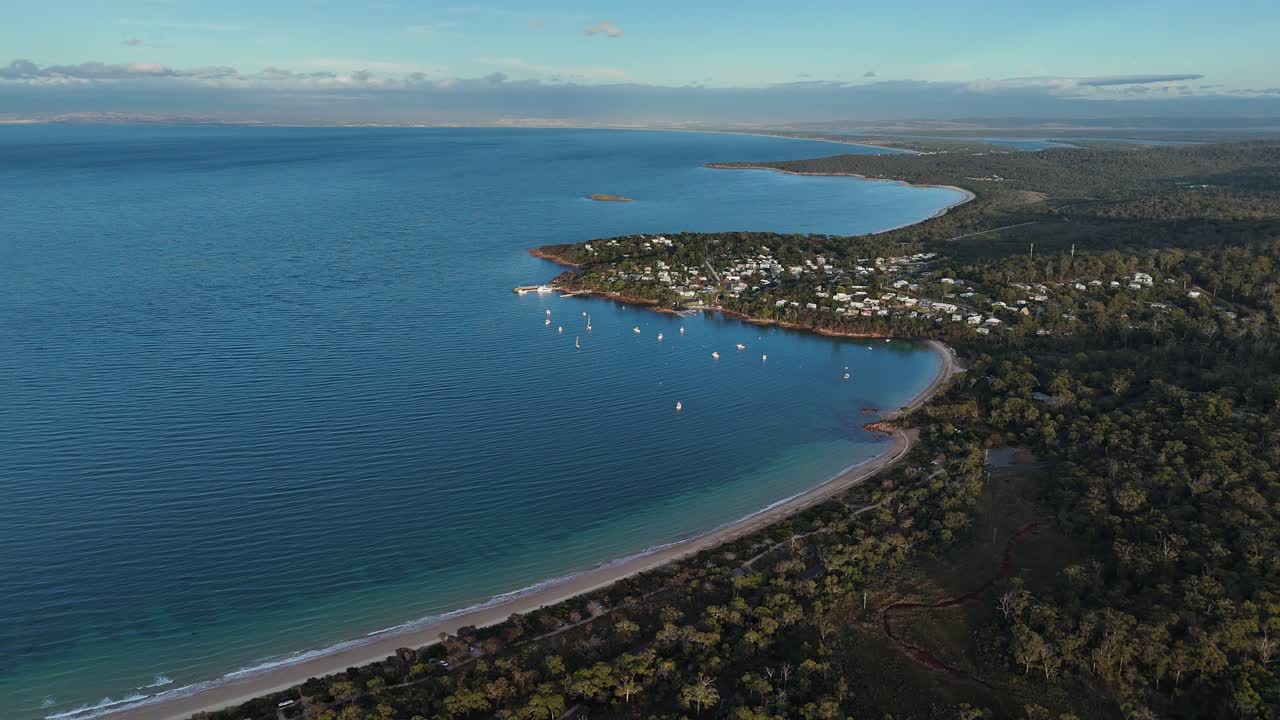 Seaside of Coles bay conservation area in Tasmania, Australia, drone shot rearward