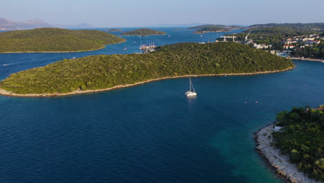 yacht sailboat travelling through croatian adriatic sea coast, aerial view