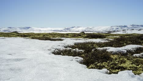 Ice-melting-in-the-mountains-during-spring--time-lapse