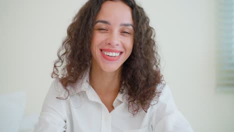 Portrait-of-Latino-Beautiful-girl-in-pajamas-smile-and-look-at-camera.-Attractive-young-woman-feel-fresh-and-happy-to-wake-up-early-from-bed-in-bedroom-in-morning-at-home.-healthy-lifestyle-concept.