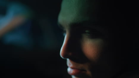 close-up portrait of a man at night