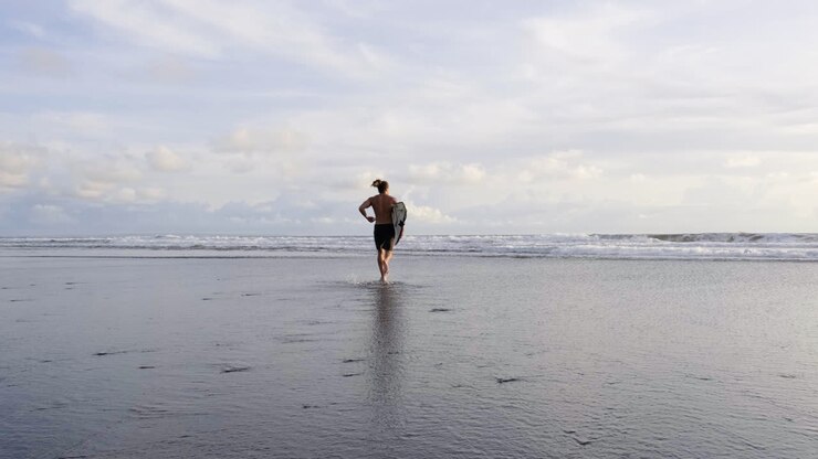 Young man with surfboards