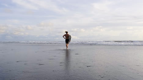 young man with surfboards