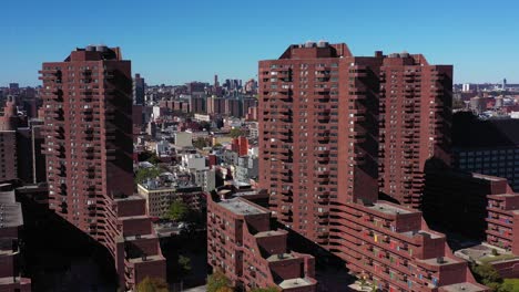 nice pullback elevating drone shot of apartment highrise buildings in harlem, manhattan, nyc