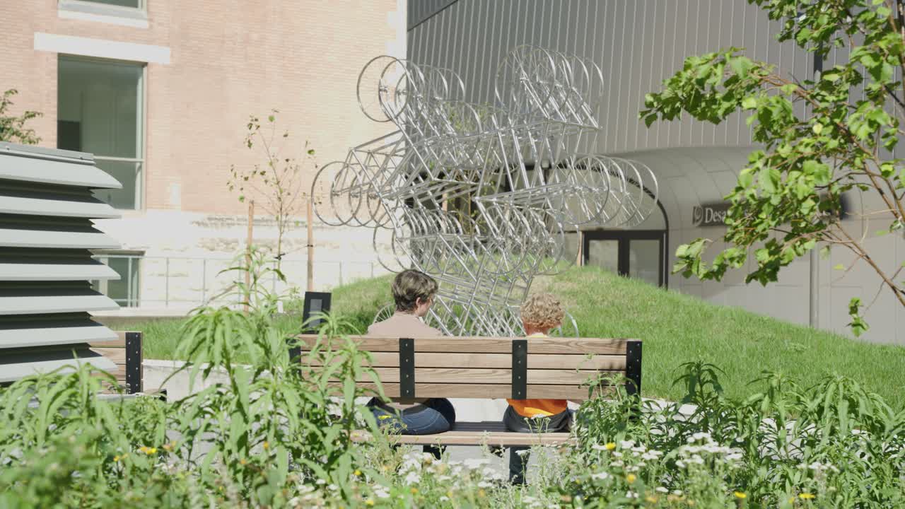 Drone captures modern University of Manitoba building over water in fall