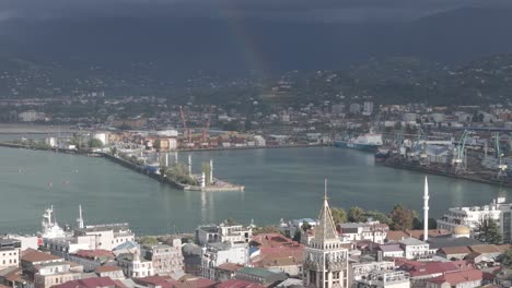 cinematic daytime drone footage of batumi port on the black sea.