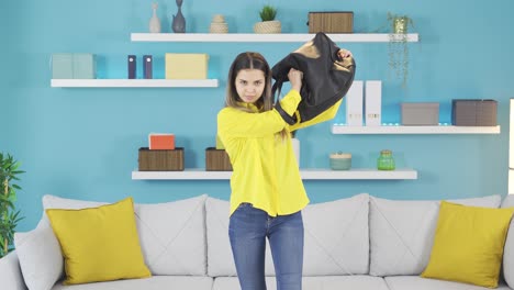 funny young girl makes funny gestures to the camera.