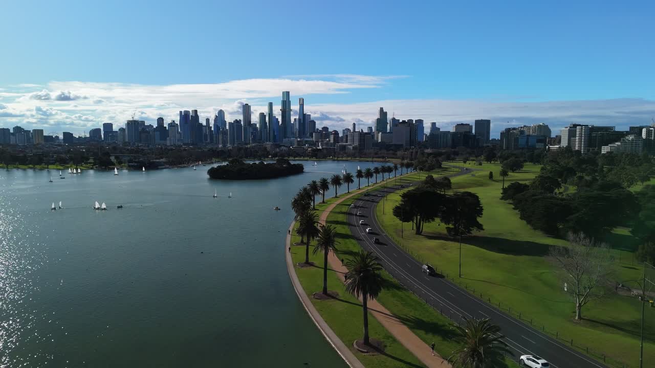 Drone flying above trees between Albert Park lake and golf course in Melbourne