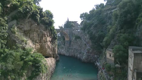 aerial boom shot above fiordo di furore in amalfi coast