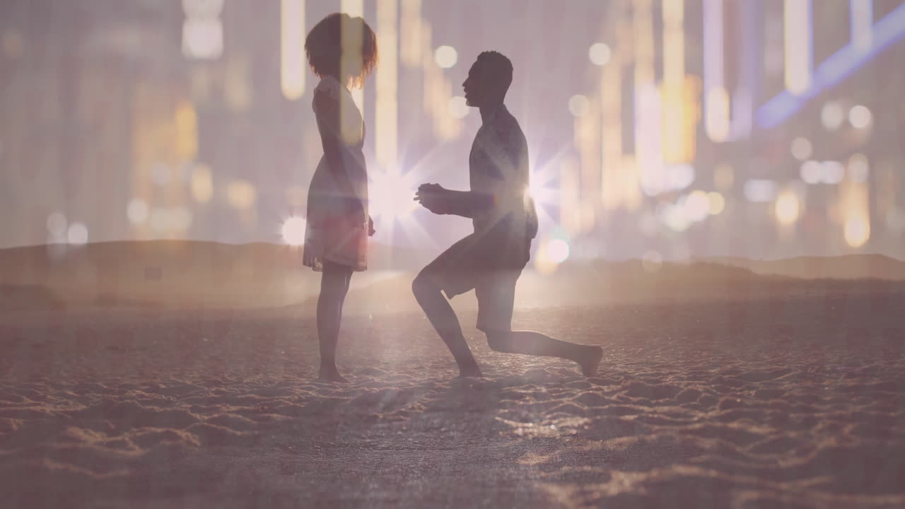 couple kneeling on sandy beach at dusk, with animated heart icons showing marketing data
