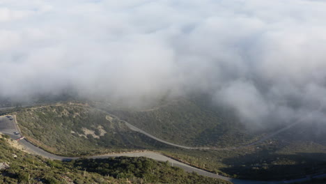 Sea-of-Clouds-Hovering-By-Hill-Side-In-Crystal-Lake,-United-States-National-Park