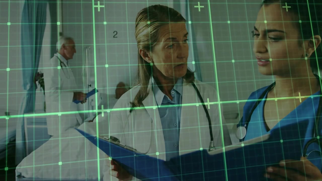 Lékař a sestra prohlížející lékařské záznamy v nemocničním pokoji