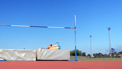 caucasian female athlete practicing high jump at sports venue 4k