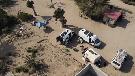 aerial orbit of overlanding campers and adventurous housing in bahia asuncion mexico