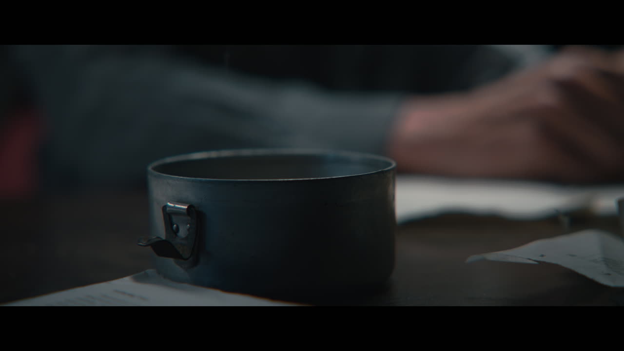 An intelligence officer smokes a cigarette
