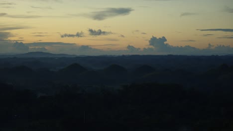 Twilight-hues-over-the-Chocolate-Hills-in-the-Philippines,-serene-landscape