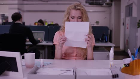 woman reading documents in an office