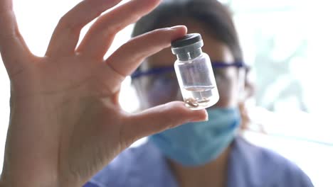 female biologist, close up woman doctor in laboratory analyzing a test tube